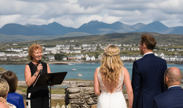Wedding celebrant in Galway leading a destination wedding ceremony in Connemara with the Twelve Bens in the background